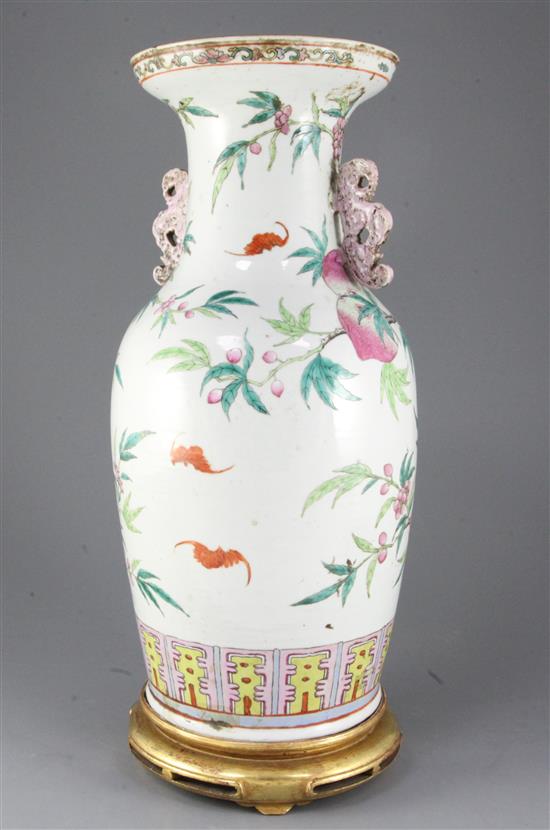 A large Chinese nine peach famille rose vase, 19th century, 45cm excluding gilt wood stand